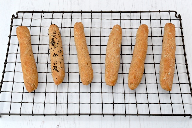 Easy no yeast spelt breadsticks cooling on wire rack.