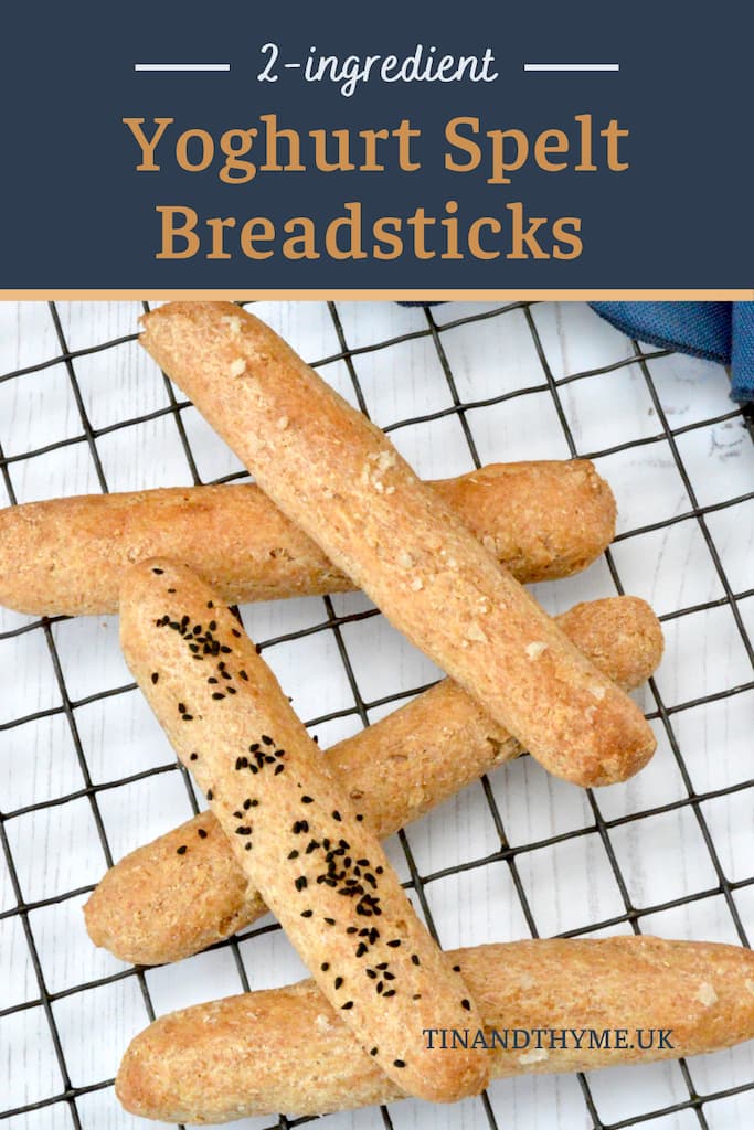 2-ingredient wholemeal spelt breadsticks piled on cooling rack.