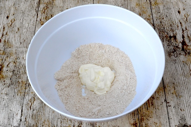 Yoghurt and flour in mixing bowl.