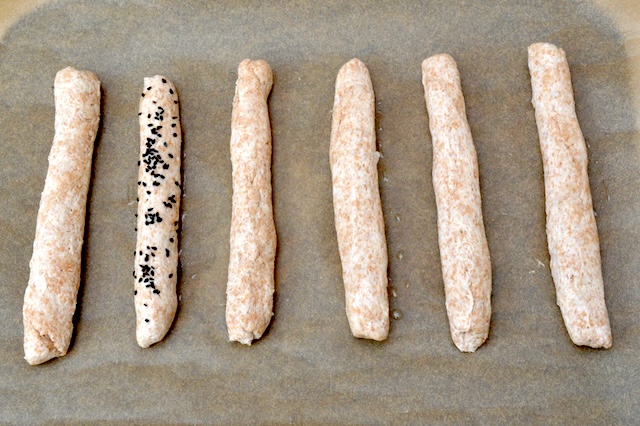 2-ingredient yoghurt dough sticks. One sprinkled with nigella seeds and two with salt flakes.