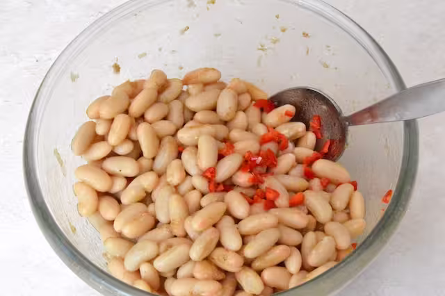 Chopped chilli added to bean bowl.