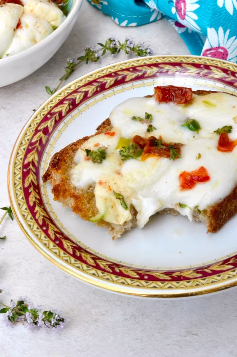 Melted marinated mozzarella balls on toast.