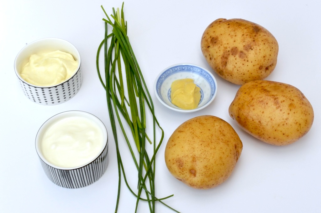 Ingredients needed to make a simple potato salad.