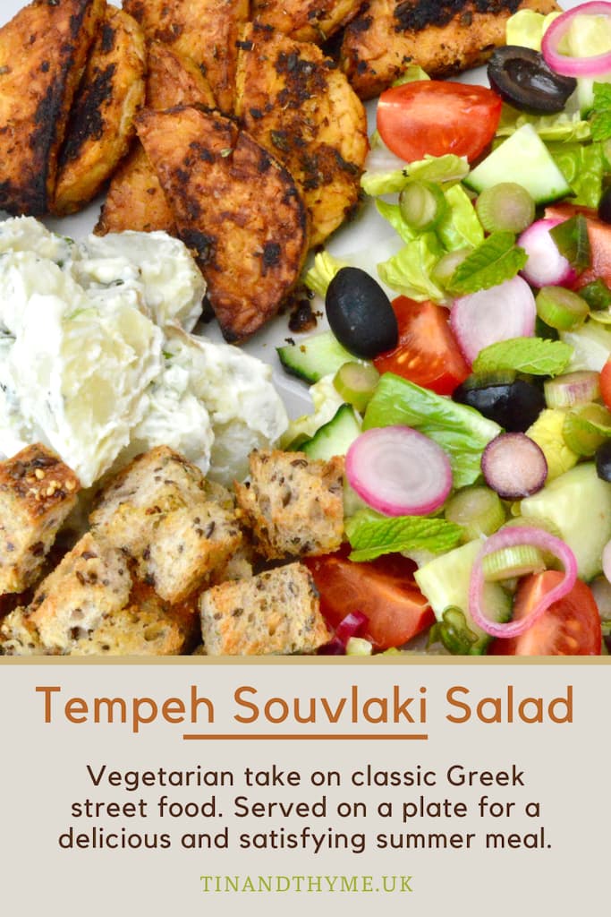 Close up of tempeh souvlaki salad on plate.