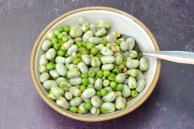 Beans and peas stirred into lemon dressing.
