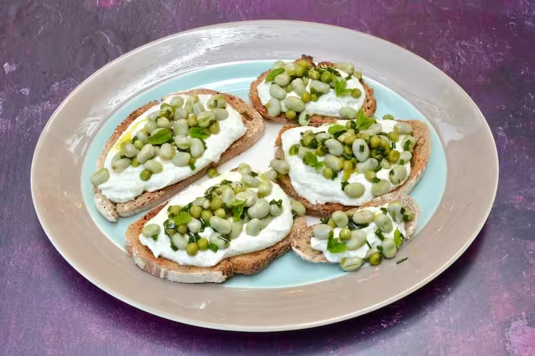 Broad bean toast with minty, garlicky whipped cottage cheese.