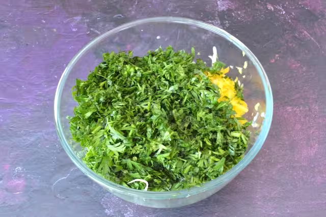 Carrot tops added to mixing bowl.