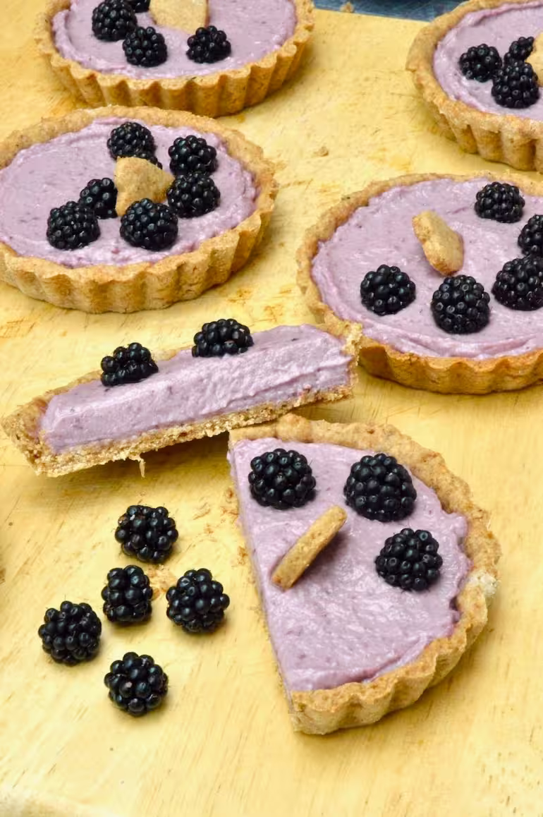 Homemade blackberry tart halved.
