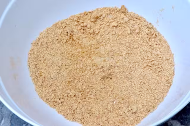 Butter and flour mix in bowl resembling breadcrumbs.
