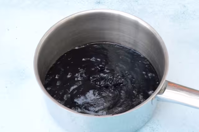 Blackberry puree in pan.