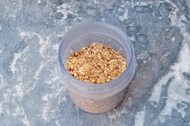 Whole almonds ground in coffee grinder.