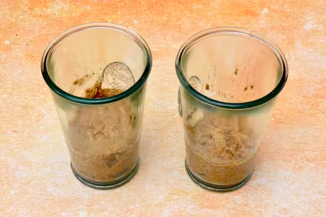 Two glasses with first layer of breakfast tiramisu added.