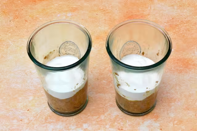 Two glasses with second layer of breakfast tiramisu added.