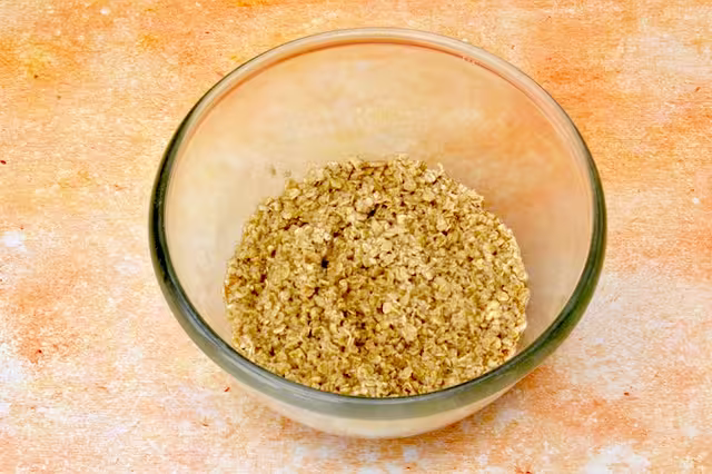 Coffee soaked oats in mixing bowl.