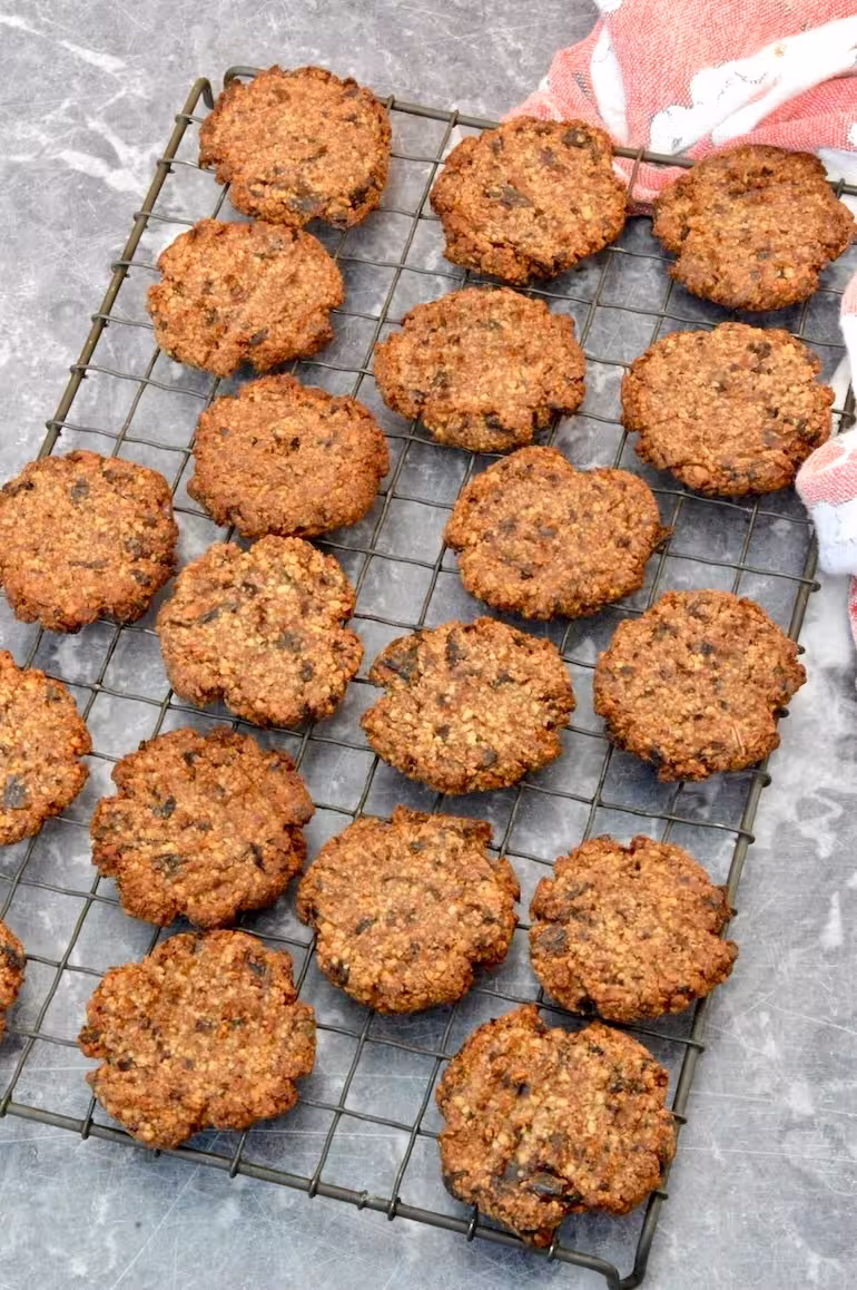 2-ingredient date and almond cookies cooling on wire rack.