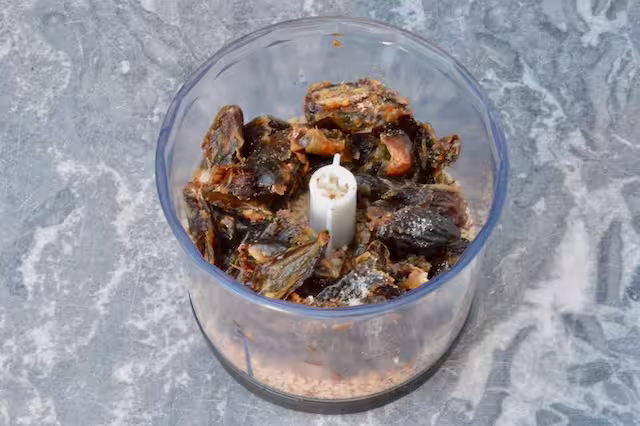Dates and almonds in food processor.