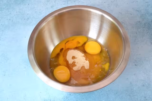 Eggs and sugar in bowl.