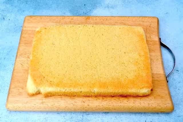 Genoise sponge on boar ready for slicing.