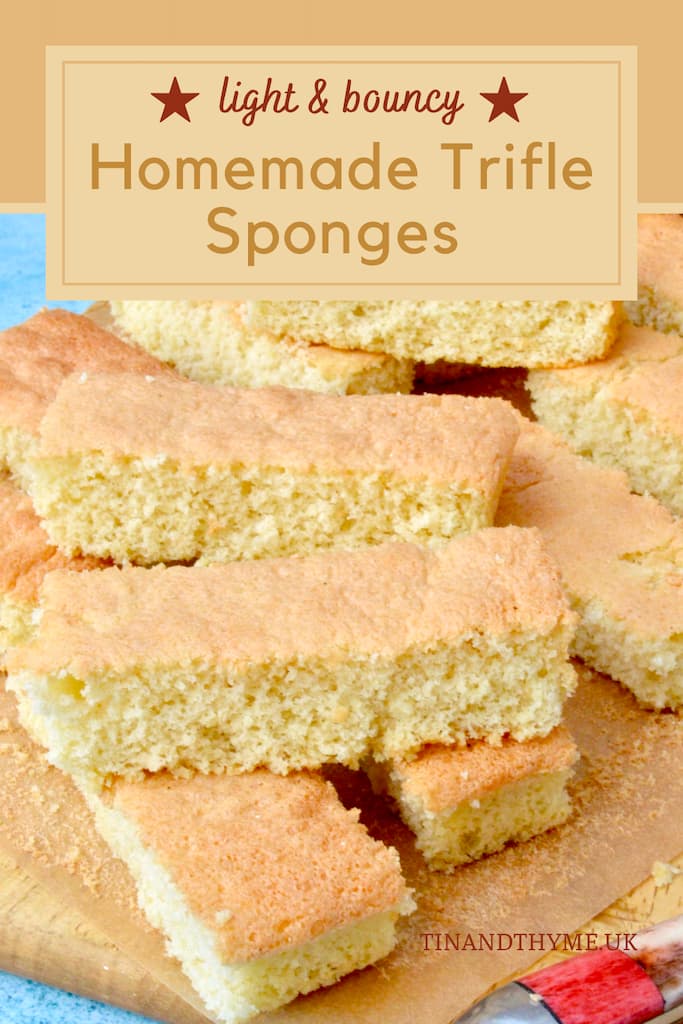 Homemade trifle sponges piled on a board.