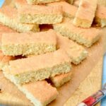 Board piled with freshly baked homemade trifle sponges.