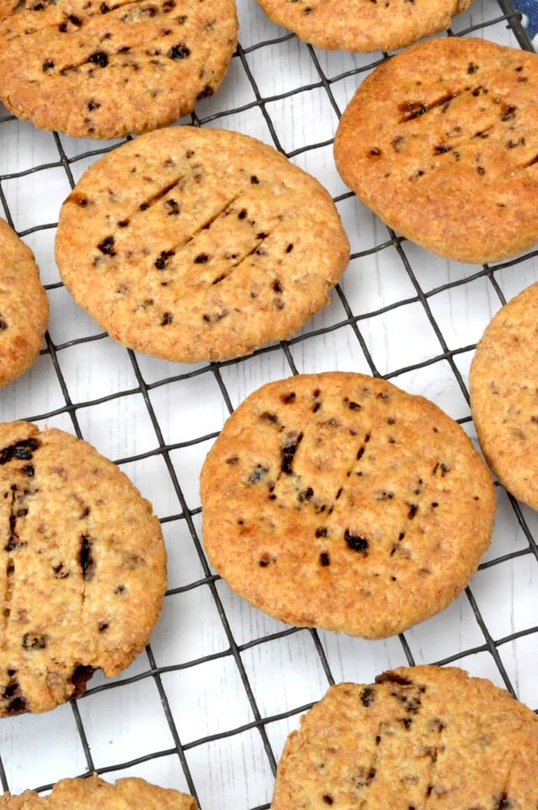 Close up of homemade wholemeal Chorley cakes cooling on wire rack.