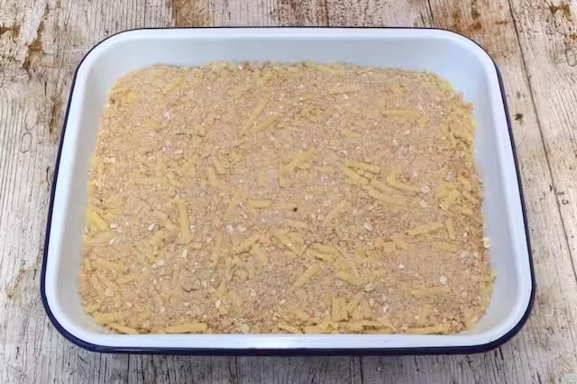 Cheesy topping in baking dish.